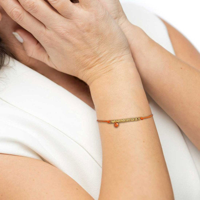 Bracciale cordino con elementi acciaio e zircone pendente